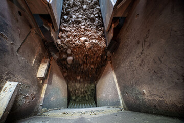 Soil falls from conveyor of crushing and sorting complex