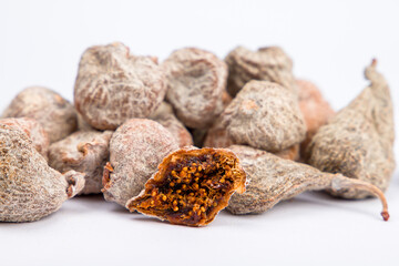 Dried baby figs. Whole and cut figs. Close up.