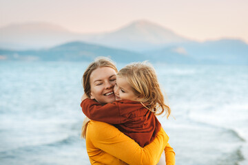 Mother hugging with child daughter family lifestyle happy emotions travel together summer vacations...