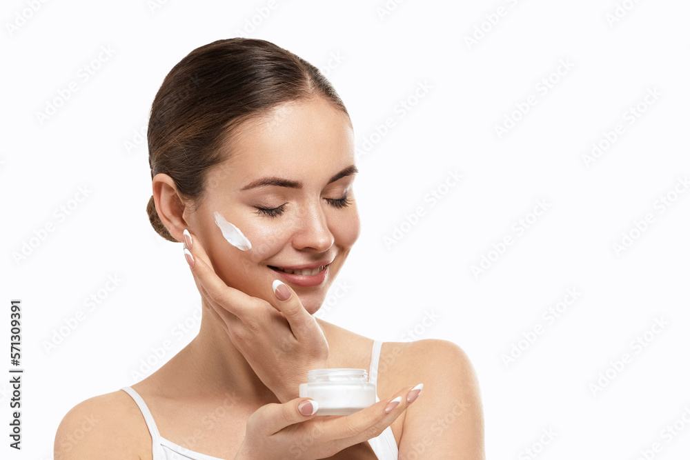 Canvas Prints Beauty skin woman natural makeup face cosmetic concept.Beautiful portrait of female face holding and applying cosmetic cream. Skin care.