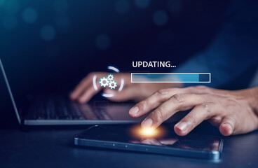 Update software system in computer. Man using smartphone upgrade program, Business technology internet loading virtual bar with installing the update for the quality better...