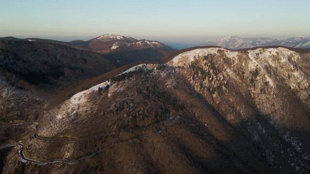 Aerial view of Mount Terminio peak with snow in wintertime, Serino, Avellino, Irpinia, Campania, Italy.