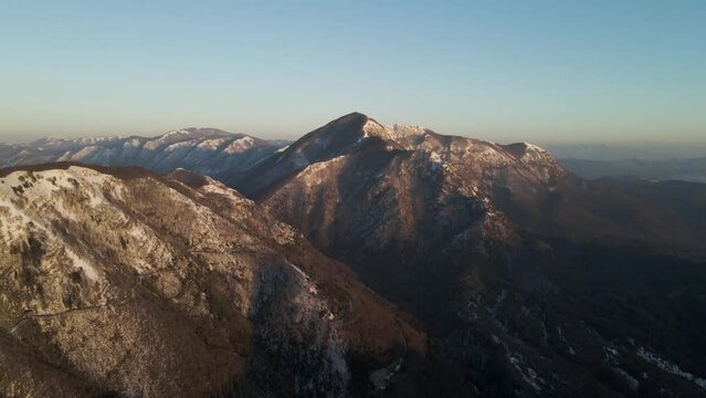 Aerial view of Mount Terminio peak with snow in wintertime, Serino, Avellino, Irpinia, Campania, Italy.