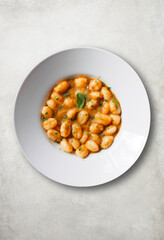 Gnocchi with pomodoro (tomato sauce) and spearmint leaves.