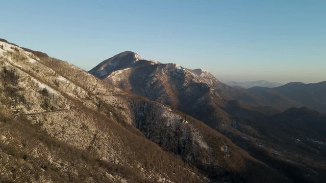 Aerial view of Mount Terminio peak with snow in wintertime, Serino, Avellino, Irpinia, Campania, Italy.