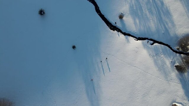 Aerial view of people on Ischia Plateau with snow in wintertime on Mount Terminio, Serino, Avellino, Irpinia, Campania, Italy.