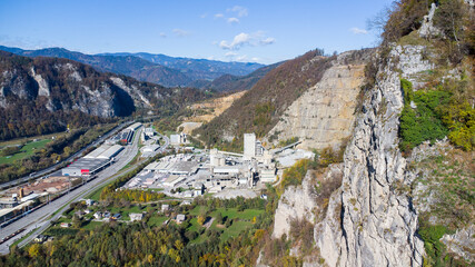 Aerial view of an industrial area in peggau with a massive stone pit and a cement factory