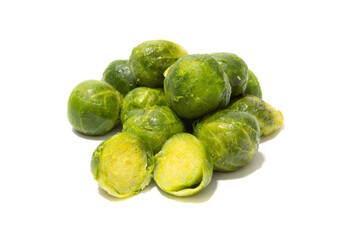 Lots of cooked brussels sprouts. Isolated on a white background. Healthy food concept.