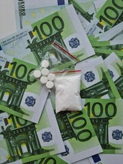 Ecstasy drug pills and euro money concept