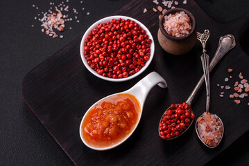 Red adjika sauce or ketchup with spices and herbs