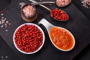 Red adjika sauce or ketchup with spices and herbs