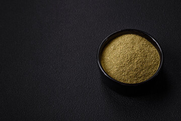 Spice dried dill or basil in the form of green powder
