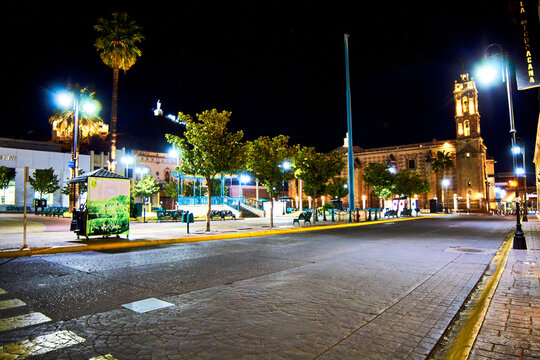 downtown at night with church in the background and alone street, in hidalgo del parral chihuahua 