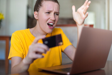 Internet fraud. Nervous sad upset unhappy confused young woman, stressed worried lady having...