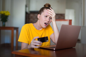 Internet fraud. Nervous sad upset unhappy confused young woman, stressed worried lady having...