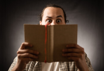 The angry student sitting on the desk with books