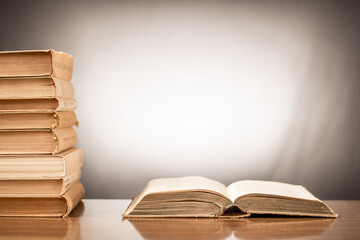 Many stacks of educational books at home preparing for exams on a white background