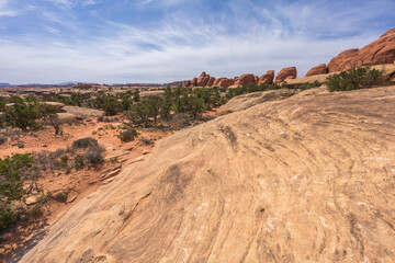 hiking the chesler park loop trail in the needles in canyonlands national park, usa