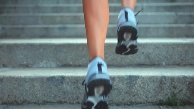 Runner jogging on stairs . Sportsman cardio endurance exercise