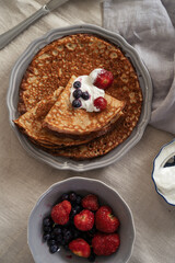 Crepes pancakes with strawberry served with sour cream