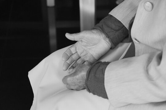 close up of a person holding their hands