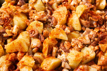 Close-up of Galician style octopus. Traditional Spanish food. Mediterranean cuisine. Pattern. Background