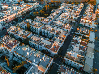Obraz premium Puerto de Mogan fishing town aerial view at sunset. Traditional colorful buildings with many fishing boats at Gran Canaria, Canary Islands, Spain