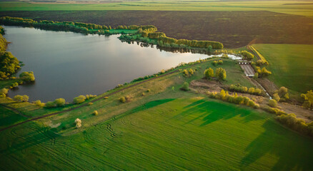lake and green spring fields