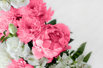 Flowers of the Fashionable color of 2023 - Viva Magenta on a white background. Top view with space to copy. Wedding flowers, bridal bouquet close-up
