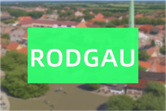 Rodgau: Der Name der deutschen Stadt Rodgau im Bundesland Hessen vor einem Hintergrundbild