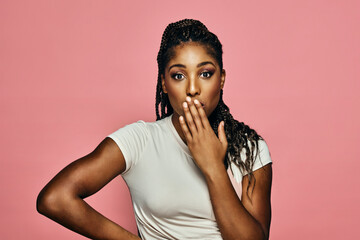 surprised astonish woman covering mouth with hand