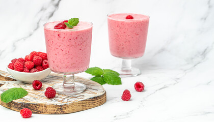 raspberry dessert in glass jar with berries. Yogurt cocktail on a white background. place for text, top view