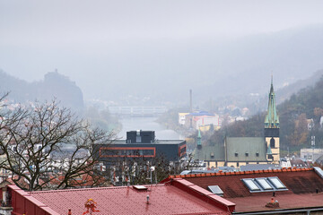 Usti nad Labem (Aussig an der Elbe), Czech north-western town in Sudetenland. Right: Church of the Assumption,  middle: Elbe river with Strekov sluice-gate, left on the hill: Strekov Castle.
