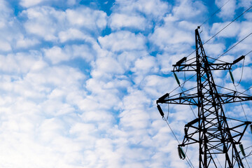 power line tower on blue sky with white clouds background