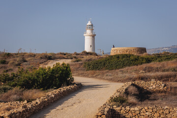 Fototapeta na wymiar Lighthouse seen from Paphos Archaeological Park in Paphos city, Cyprus island country, view with Lighthouse