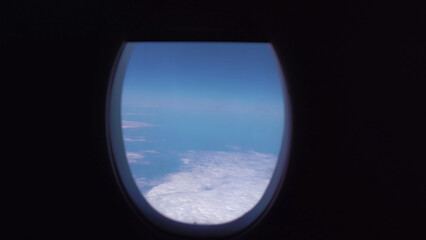 View through airplane window of the beautiful clouds