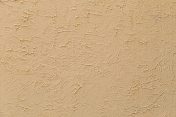 Rough textured wall surface, decorative plaster. Backdrop for design, graphic resource. Texture background.