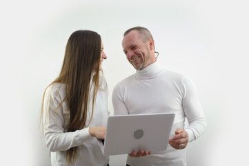 sincere smile laughter joy love man and woman with laptop in hands on white background look at each other laughing having fun something funny joke successful project good shopping end work office fun