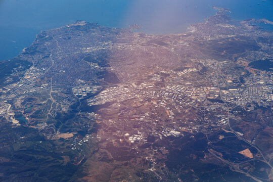 Aerial view from plane window with areas of Istanbul city and Gebze city on the shore of Marmara Sea, Turkey