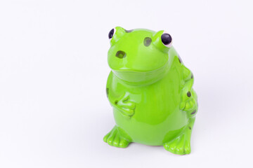 Cute ceramic frog figurine with copy space