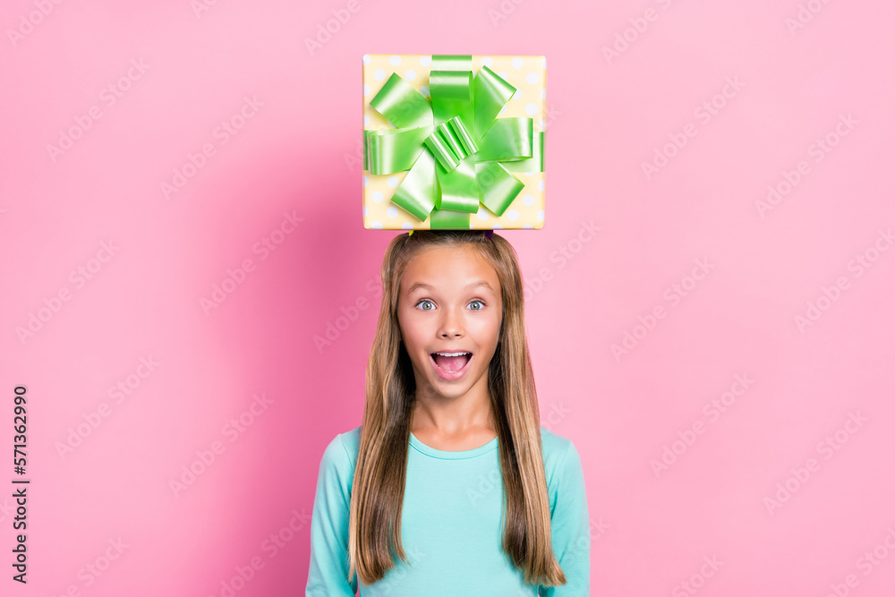 Wall mural Photo of impressed cheerful person open mouth hold giftbox head isolated on pink color background