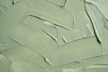 Plakat Green cosmetic clay texture close up. Cosmetics texture mask clay for face and body