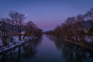 Color Enns river in sunrise frosty morning in Admont town