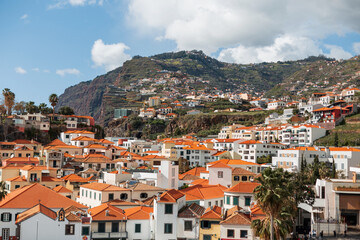 Fototapeta na wymiar Amazing Mountains and beautiful houses with orange roofs on the island of Madeira
