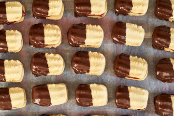 Homemade Christmas cookie filled with marmalade and dipped in chocolate