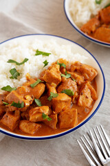 Homemade Easy Indian Butter Chicken with Rice on a Plate, side view.