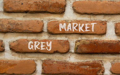 Grey market symbol. Concept words Grey market on red brown brick wall. Beautiful red brown brick wall background. Business grey market concept. Copy space.