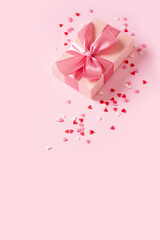 Candy pink confetti with gift box on pink background