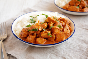 Homemade Easy Indian Butter Chicken with Rice on a Plate, low angle view. Close-up.