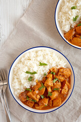 Homemade Easy Indian Butter Chicken with Rice on a Plate, top view. Flat lay, overhead, from above.